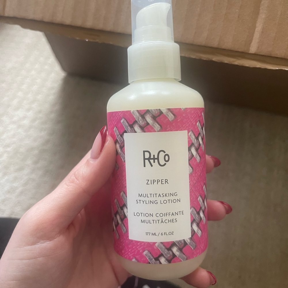 R+Co Zipper Styling Lotion with Pink Accents